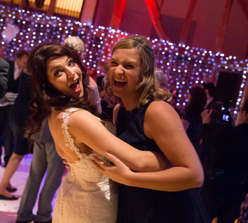 Wedding guests dancing and celebrating on a packed dancefloor