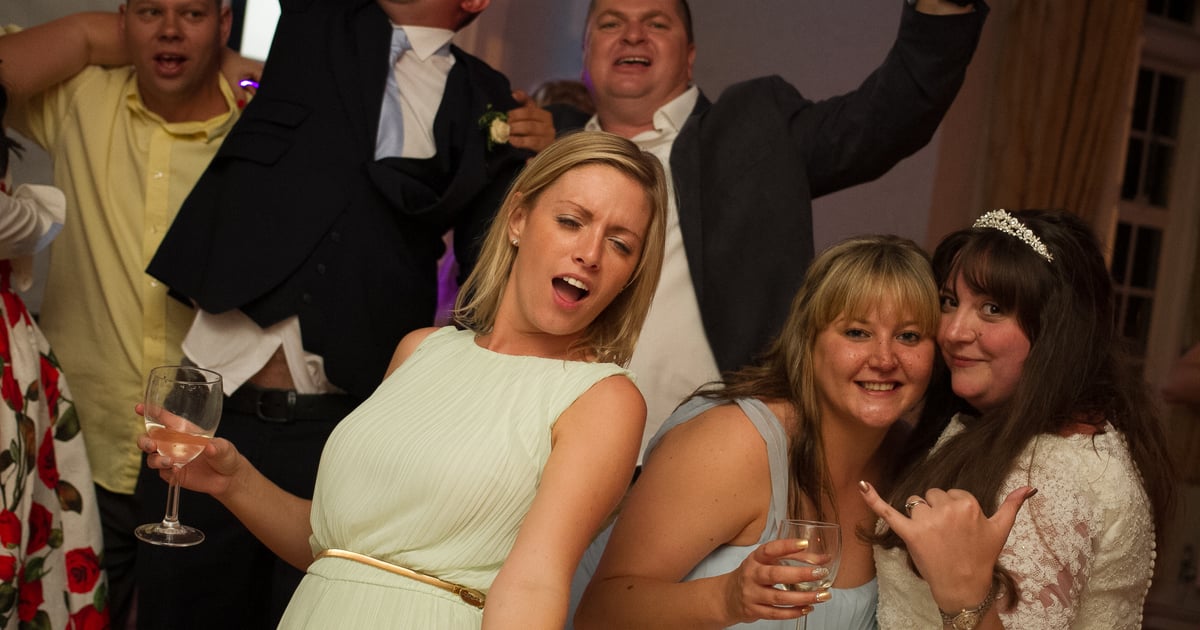 Couple reviewing wedding plans together on a laptop screen