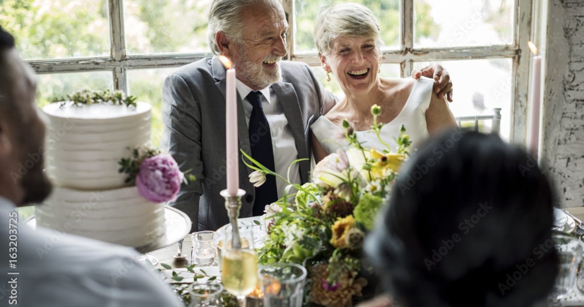 Happy mature couple at their wedding celebration