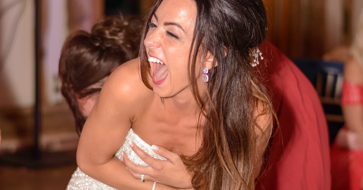 Bride laughing heartily during her wedding reception