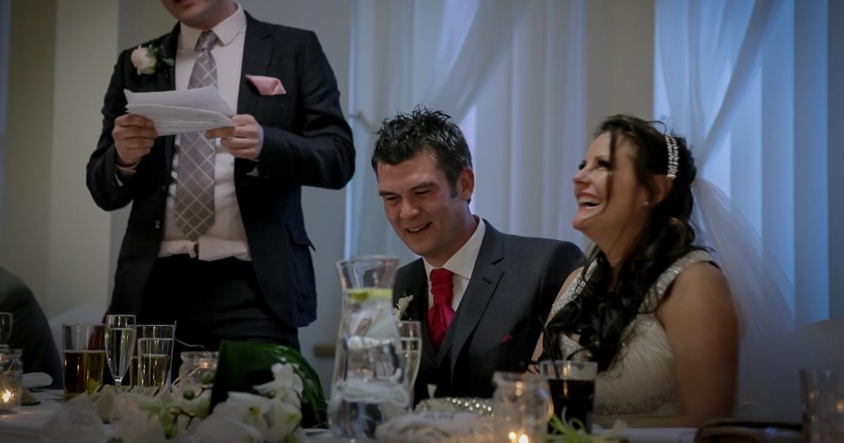 Wedding guests laughing during breakfast introductions