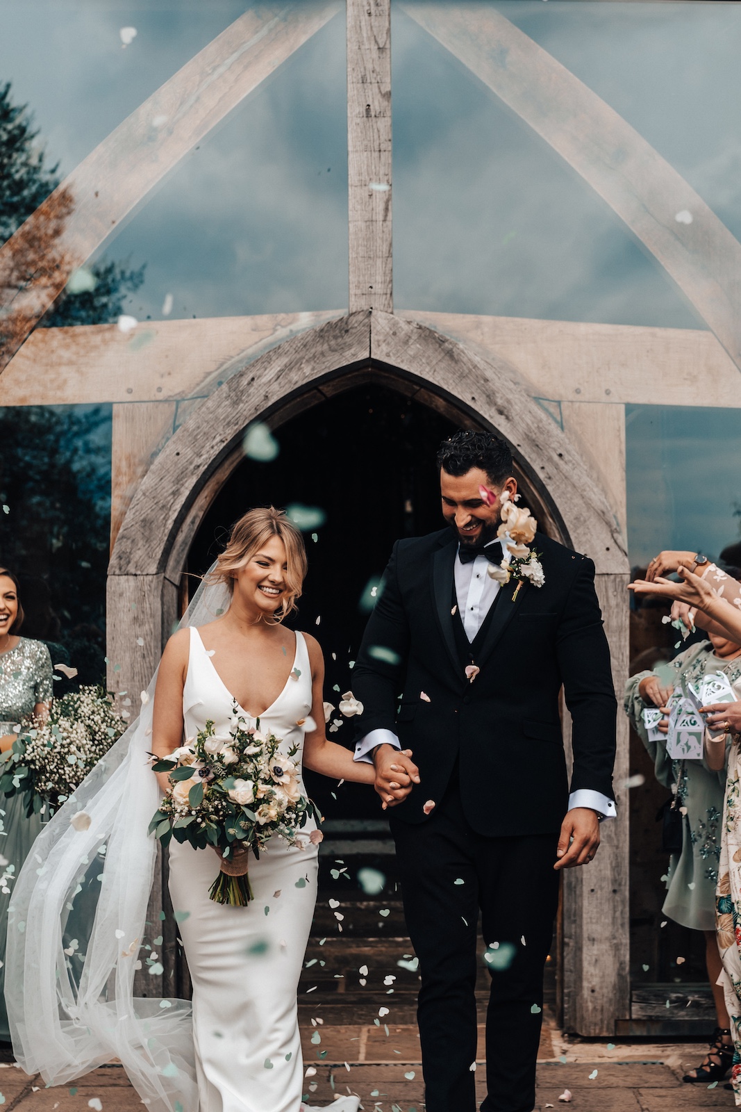 Exterior of Cripps Barn surrounded by greenery and rustic charm
