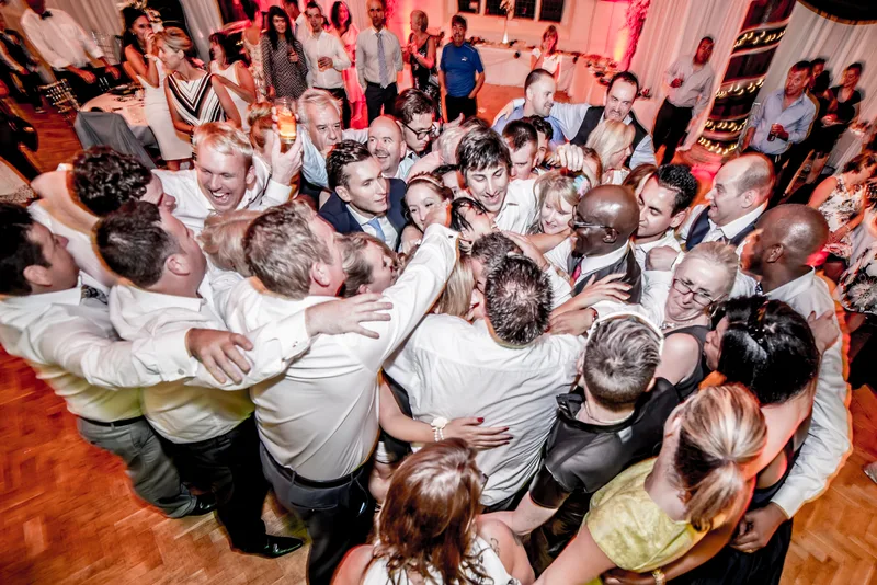 Live band and DJ setup at a wedding celebration