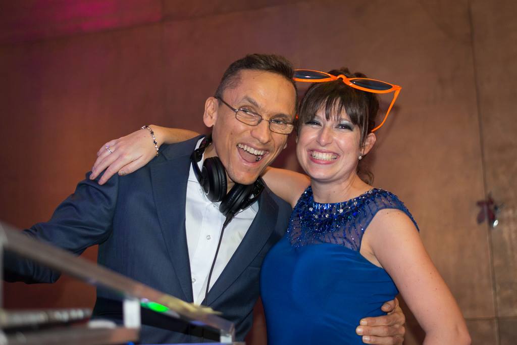 Couple discussing music with their DJ