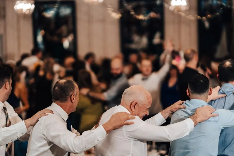 Men dancing together