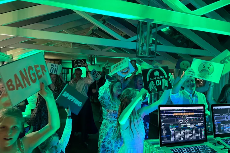 Packed dance floor singing along