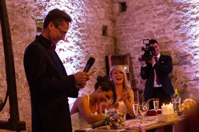 Happy couple and guests during wedding planning consultation