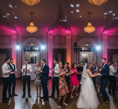 Split scene of a turntable and a packed wedding dancefloor showing how one song choice steers the night